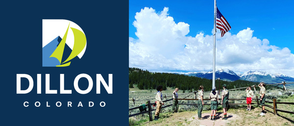 Boy scouts saluting the American Flag at half mast