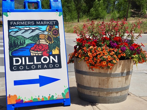 Flowers next to the Dillon Farmers Market Sign 