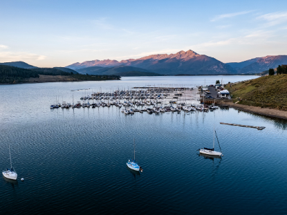 Overhead view of boats moored at Lake Dillon, highlighting the tranquil waters and stunning natural landscape of Dillon Colorado.