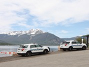 A clear blue sky dotted with fluffy white clouds, creating a serene and peaceful atmosphere.