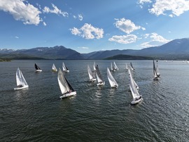 boats sailing against the mountain backdrop
