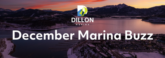 Sunset casts warm hues over mountains and a lake, framing a tranquil town at the water's edge.