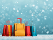 Four shopping bags sit in the snow 