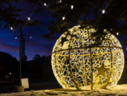 an illuminated orb sits in the snow 