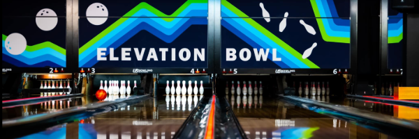 a colorful image of a bowling alley with staged bowling pins and balls