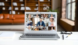 Laptop screen with virtual meeting participants