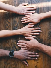Diversity of hands on a table