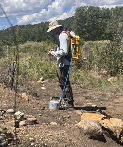 ECMC contractors use a tool called a flux meter to collect methane samples.