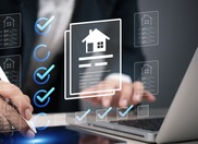 digital image of a man touching computer screen of houses checking boxes