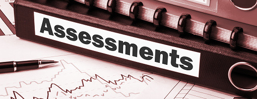 Binder titled Special Assessments on an office desk