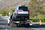 Car carried by a tow truck