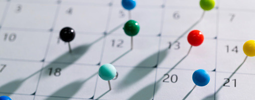 Calendar with pins on it