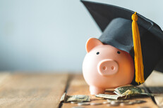 Piggy bank with graduate cap 
