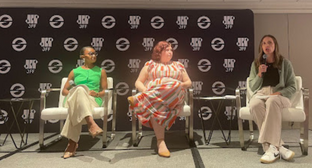 Three panelists seated on stage during a discussion at the JFF Horizons Conference.