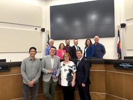 Green Business Program Coordinator Aidan Lawton with tri-Cities Mayors and Littleton City Council Accepting 2025 Mayors Climate Protection Award