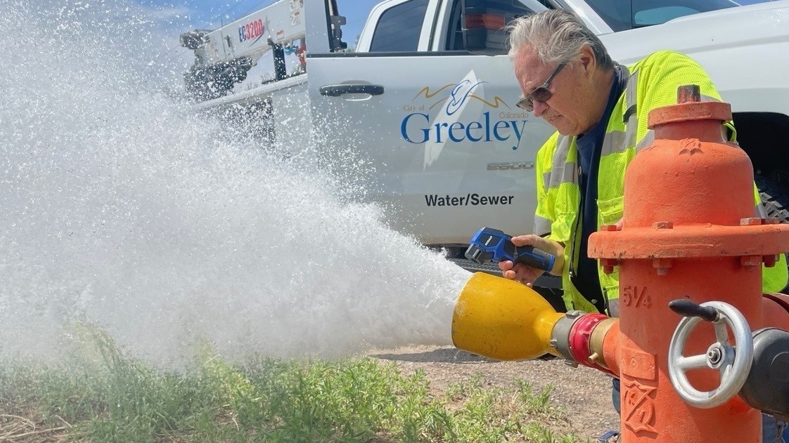 A fire hydrant specialist monitors the flushing of one of the city's 3,800 hydrants.