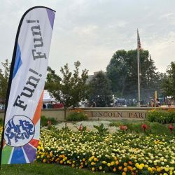 Lincoln Park entry with Fun! Fun! banner and flowers in bloom