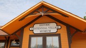 close up of train depot with a sign that says Centennial Village Museum