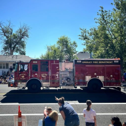 Greeley Fire Department Fire Truck drives down the street during a parade