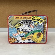 Red metal lunchbox with City of Greeley branding all over the front of it