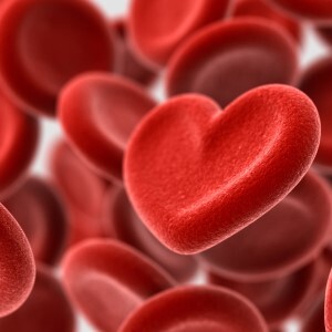 Many red hearts resembling blood molecules on a white background.