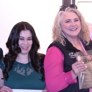 Tania Gutierrez (left) and Kirsten Muncy (right) smile and show their awards