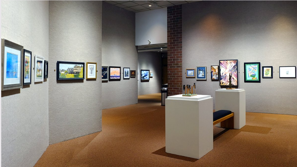 artwork hangs on gallery walls