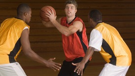 Men playing basketball on the court