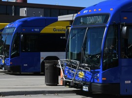 Two Greeley-Evans Transit buses parked in front of the Regional Transportation Center.