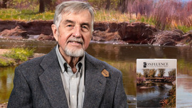 Dr. Michael Welsh poses with his book.