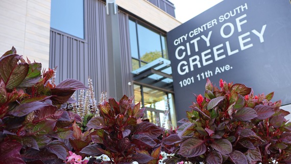 flowers in foreground of City Center South building sign