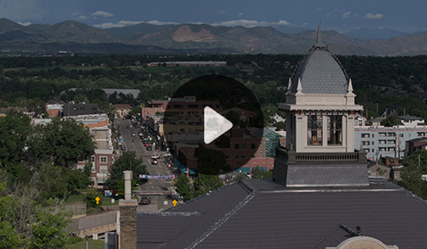 Aerial view of Downtown Littleton with a play button icon