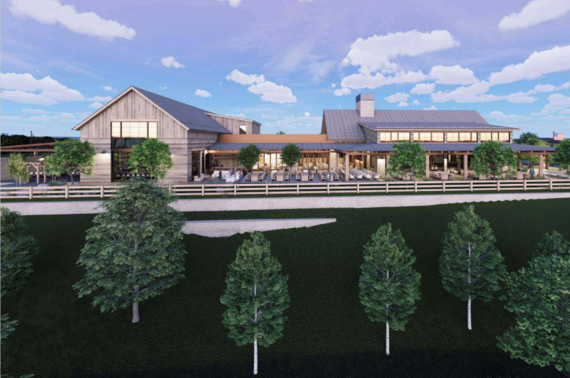 Modern farmhouse-style building with large windows, outdoor seating, and trees in front under a blue sky with clouds.