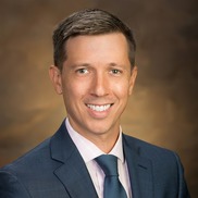A studio portrait of Littleton Mayor Kyle Schlachter