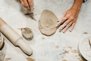 Clay Garden Décor: image of making clay with leaf imprints