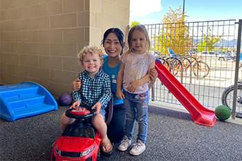 Photo of lady with two kids in Child Watch 