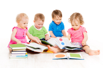 Baby: Image of 4 babies holding books and toys