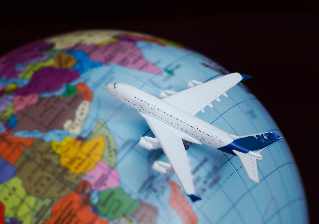 Travel: Image of globe with toy airplane