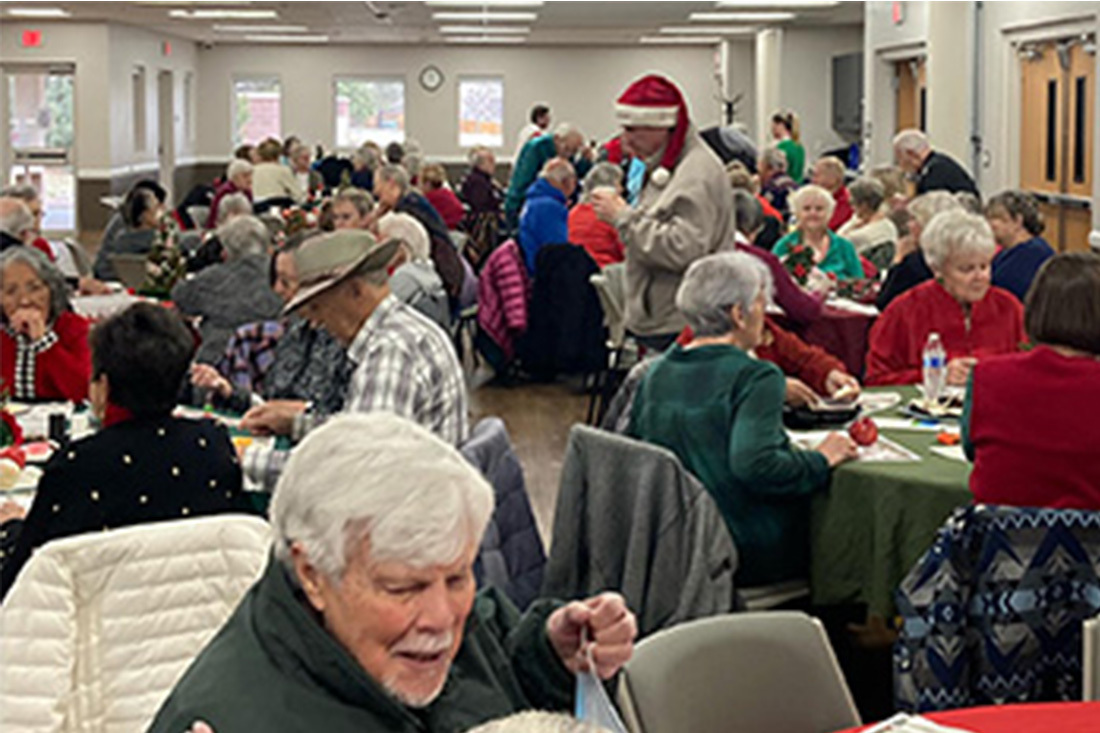 room full of seniors at holiday lunch