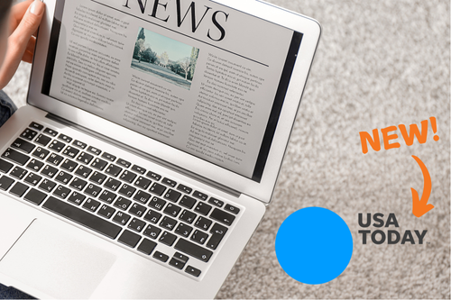 laptop with news on screen