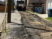 workers repaving alley behind city hall