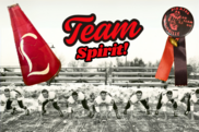 black and white football team lineup with a red bullhorn and red pin that reads, "Louisville Pirates Go Team Go"