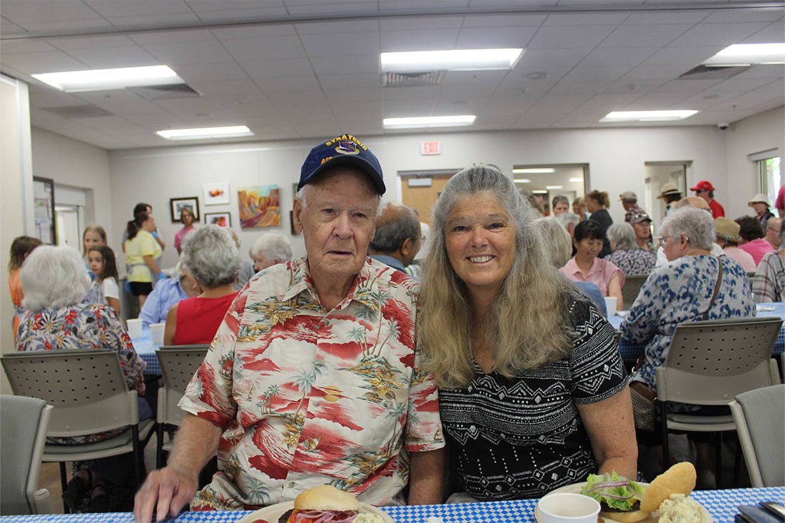 older adults sitting at a lunch table