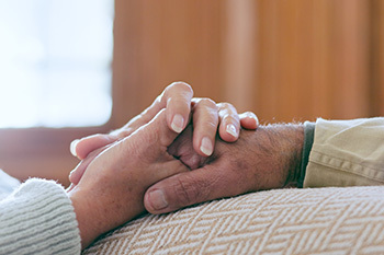 image of two people holding hands