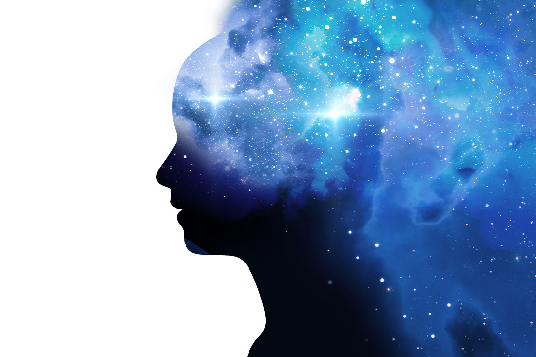 a silhouette of a persons head combined with a Galaxy