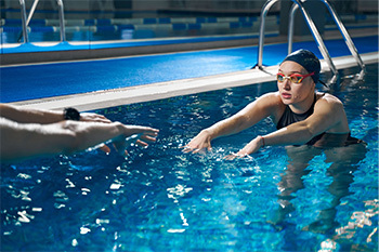 adult taking swim lessons