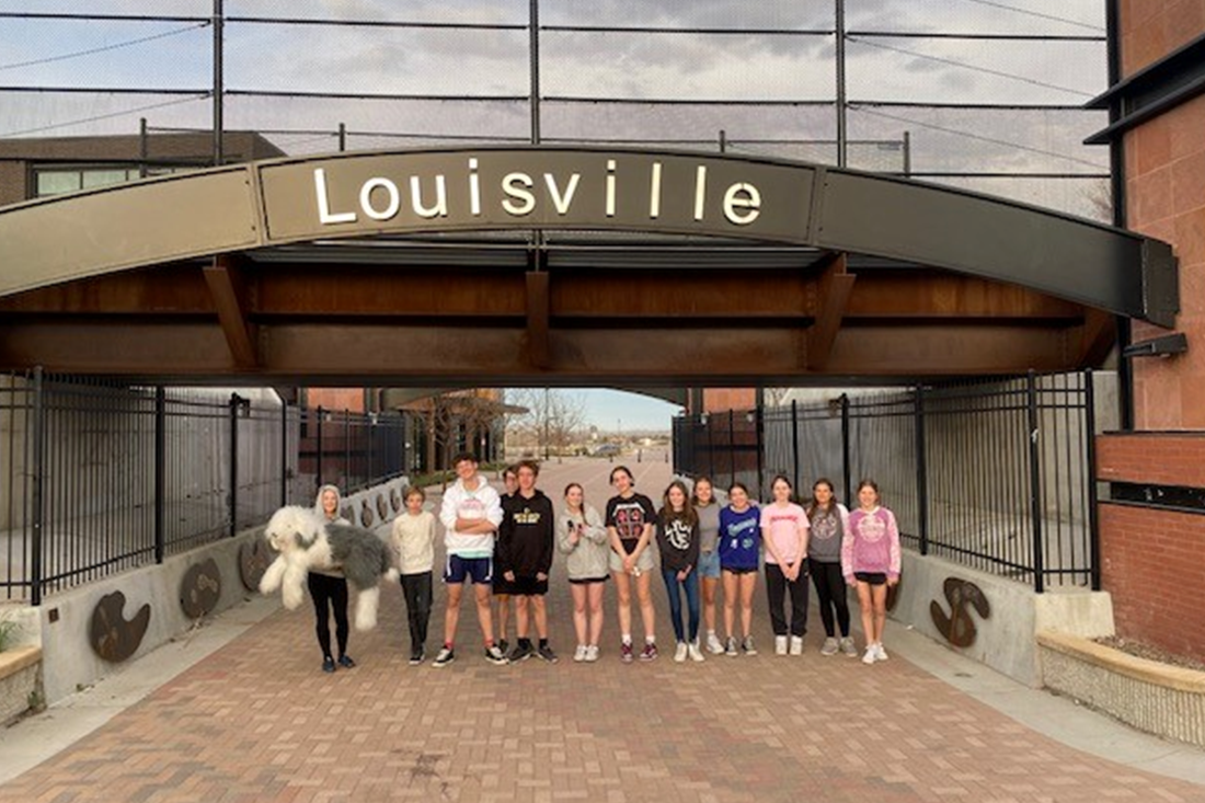 The Youth Advisory Board standing in front of a underpass