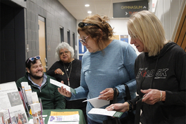 two seniors looking at a pamphlet