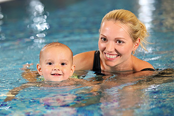 Young child taking swim lessons