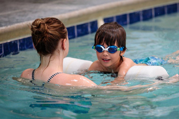 Kid taking swim lessons